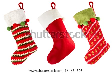 Santa Claus sock with Christmas balls on wooden floor