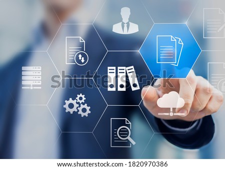 Document Management System (DMS) used to store, search and manage review process and users for corporate files and information in enterprise. Concept with business manager pointing to icons. Foto stock © 
