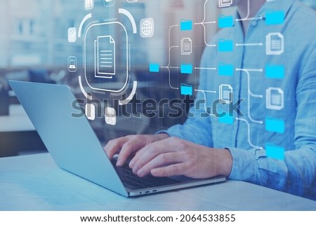 Document Management System (DMS) and business processes with IT expert working on laptop computer. Solution for archiving, searching and managing corporate files and data. Digital transformation. 商業照片 © 