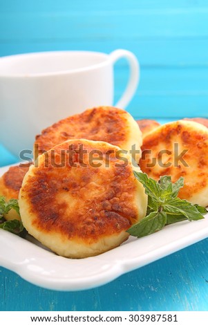 Syrniki (Cottage cheese pancakes, Fritters of cottage cheese) traditional Ukrainian and Russian cuisine.