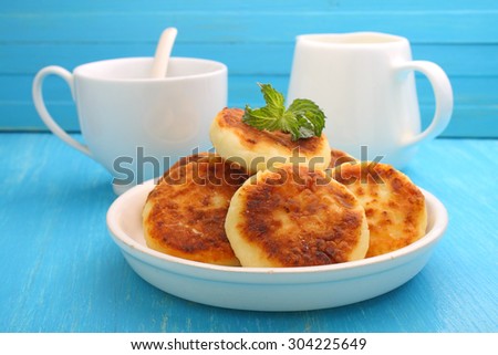 Syrniki (Cottage cheese pancakes, Fritters of cottage cheese) traditional Ukrainian and Russian cuisine.