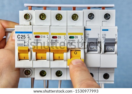 Fuse board replacement. Circuit breakers are the most common form of overload protection found in homes. Electrical consumer unit installation. Foto d'archivio © 