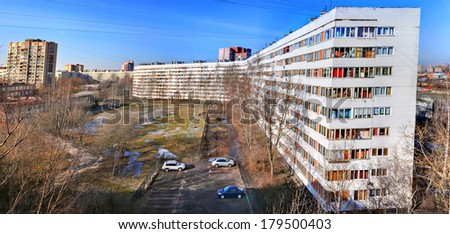 ST. PETERSBURG, RUSSIA - FEBRUARY 26, 2014: Dwelling house white, multistory, 9 floors. Apartment building white color, very long.