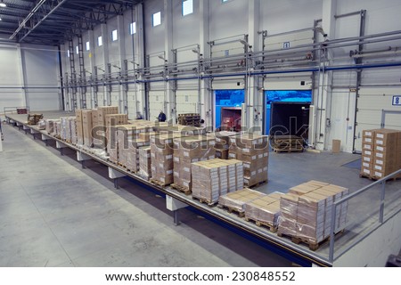 St. Petersburg, Russia - November 21, 2008: Unloading system, inside warehouse doors loading dock. The inner space of the warehouse with a cargo platform for loading dock.