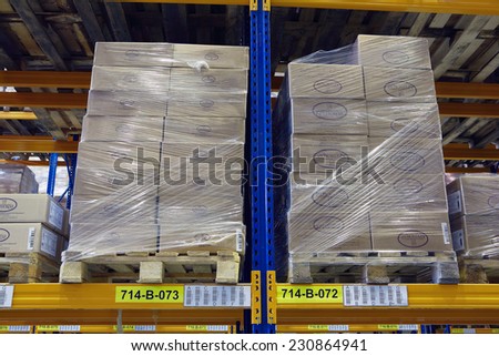 St. Petersburg, Russia - November 21, 2008: Pallets with foodstuffs stand on a rack shelf goods warehouse.