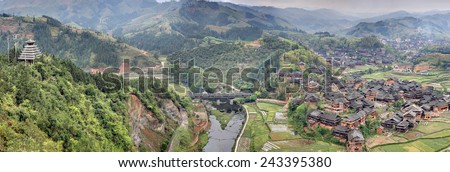 Sanjiang, Guangxi Province, China - April 6, 2010:  Chengyang Wind and Rain Bridge, Wooden bridge Chengyang Dong Villages, tourist attractions in the vicinity Sanjiang, countryside in mountain area.