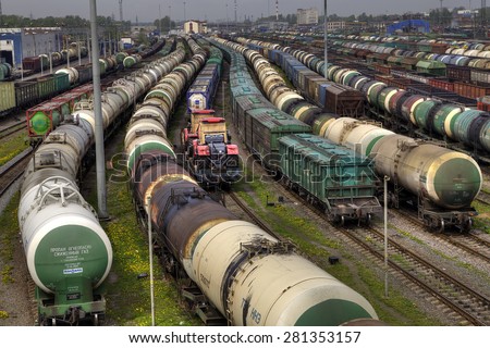 St. Petersburg, Russia - May 22, 2015: Trains of freight wagons in marshalling yard, Railway yard with a lot of railway lines and freight trains, Rail freight marshalling yard, Russian Railways.