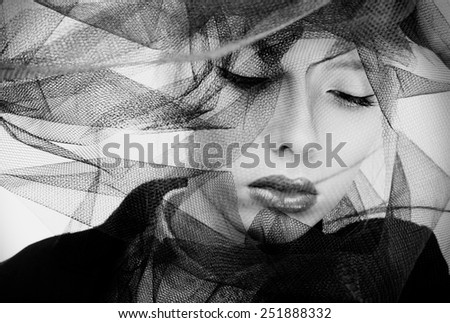 Black and white portrait of a beautiful veiled woman
