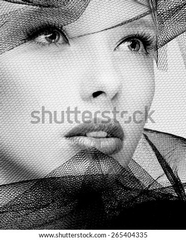 Black and white photography of a beautiful veiled fashion model face