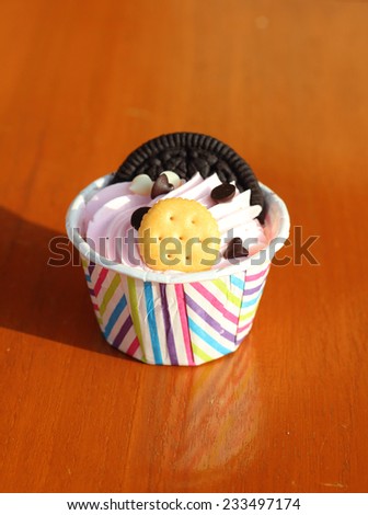Mini cupcake with biscuit on top