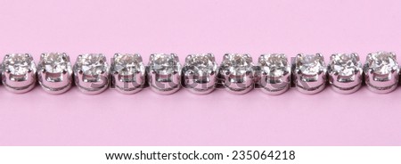 Diamonds bracelet on pink background