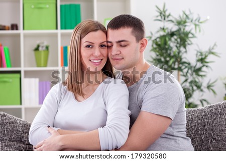 Love couple sitting on the sofa