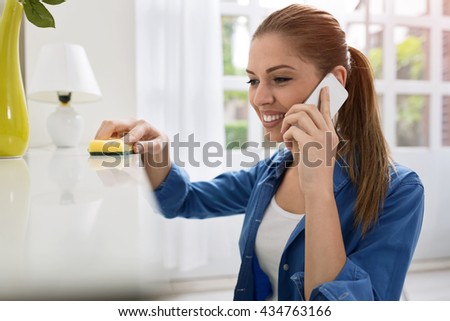 Young girl cleaning house Young girl cleaning house