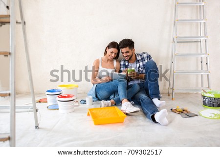Couple moving in new renovate home, looking new design for home Foto stock © 