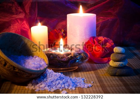 three candles camellias stones and salt