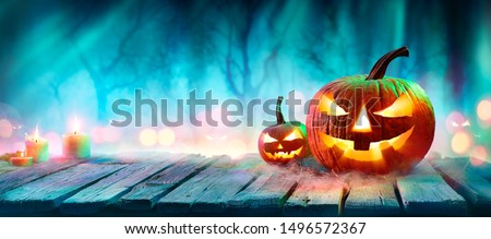 Jack O’ Lanterns In Spooky Forest With Ghost Lights - Halloween Background
