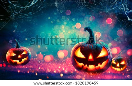 Halloween Abstract Party - Smiling Pumpkins On Defocused Shiny Background

