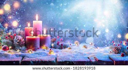 Similar – Image, Stock Photo advent wreath with burning red candles standing on wooden table in living room with candle arch in window