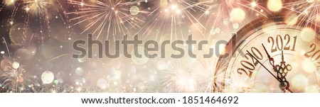 Happy New Year 2021 - Abstract Defocused Background - Clock And Fireworks Waiting Midnight