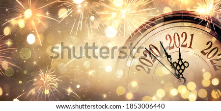 Photo of Countdown To Midnight - Happy New Year 2021 - Abstract Defocused Background - Clock And Fireworks 