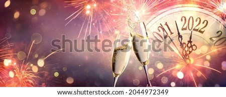 Photo of 2022 New Year Celebration - Countdown And Toast With Champagne And Fireworks On Abstract Defocused Background
