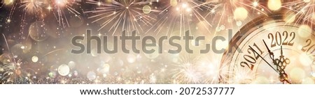 2022 New Year - Golden Clock With Fireworks And Defocused Abstract Lights