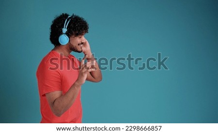 Similar – Image, Stock Photo Latin man listening to music with earphones.