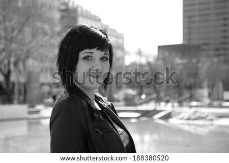 Pretty girl downtown on a sunny day in black and white