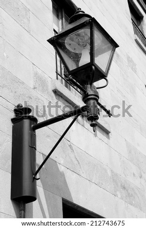 Old style carriage light on the exterior of an old building