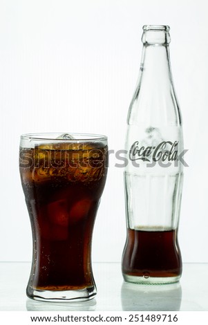 THAILAND - July 21,2014 : Coca-Cola glass and Coca Cola classic bottle with water drops on .
