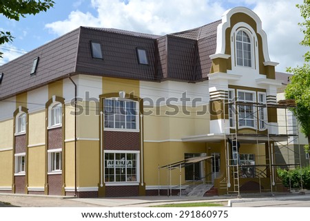 GUSEV, RUSSIA - JUNE 04, 2015: Finishing works on a mansion facade