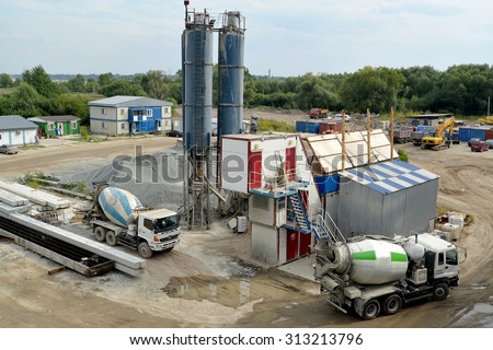KALININGRAD, RUSSIA - AUGUST 24, 2015: Ready-mix trucks mixers stand on loading in the territory of concrete knot