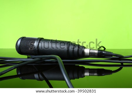 black microphone cable on the glass