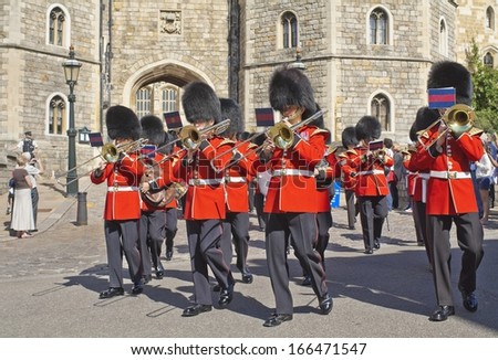 WINDSOR, ENGLAND - AUGUST 28: Royal Guards come out of Windsor Castle, one of the official residences of the British Royal Family in August 28, 2012