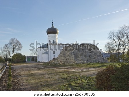 Cathedral of the Nativity of the Virgin in Snetogorsky monastery in Pskov, Russia with the ruins of gigantic bell-tower on the foreground