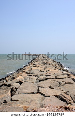 Seawall in Kanyakumari,South India. Located at the southernmost part of India, kanyakumari is a place at the confluence of the Indian ocean, the Bay of Bengal and the Arabian Sea.