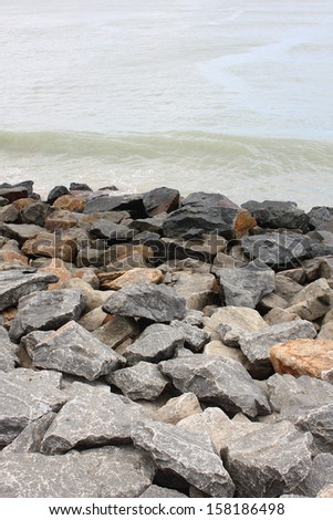 Sea wall with rocks to protect the shore.