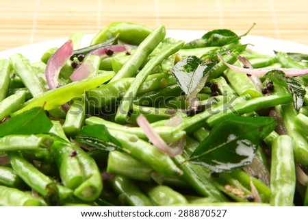 Stir fry organic green beans with spices.Shallow depth of field photograph,