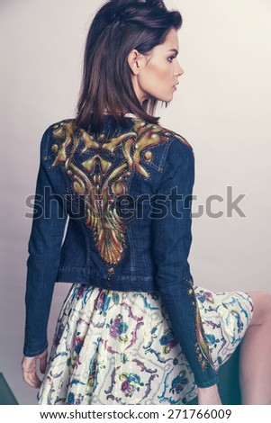 Woman in denim jacket and skirt