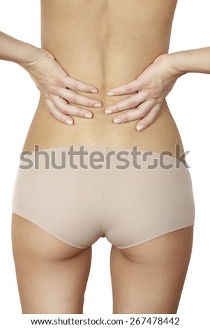 girl standing and massaging sore back