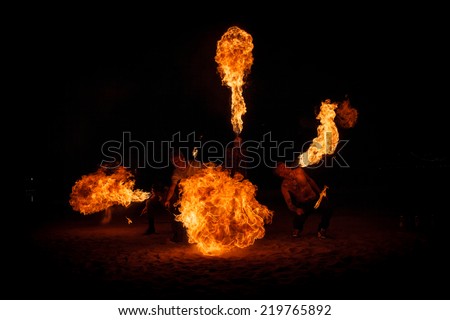 SAINT-PETERSBURG, RUSSIA - SEPTEMBER 19, 2014 : A group of firedancers perform fire breathing  on \