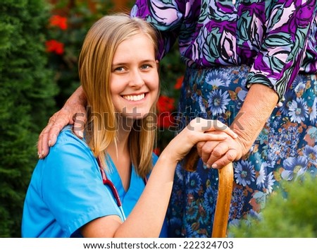 Smiling doctor giving a helping hand for elderly patient.