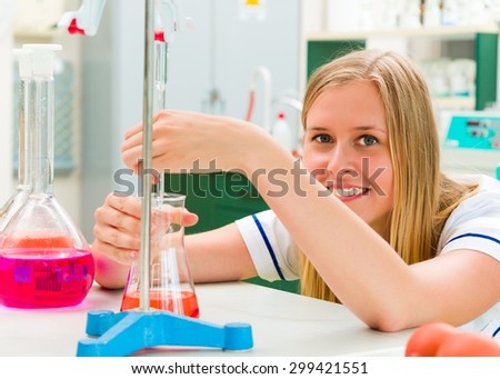 Determined young chemist working in the analytical laboratory.