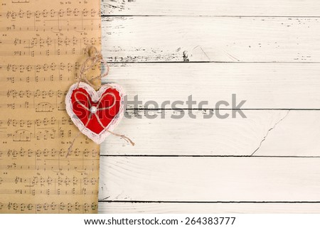 background with plush heart and music notes on wood plank