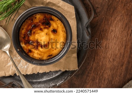 Similar – Image, Stock Photo Cream brulee on dark wood