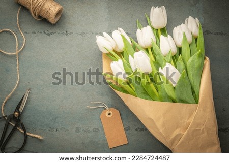 Similar – Foto Bild Blumenstrauß aus weißen Tulpen in einer Vase