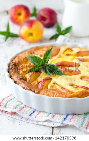 Cottage cheese baked pudding with a peach. Selective focus