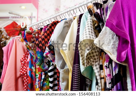 Clothes of different colors on vintage metal hanger