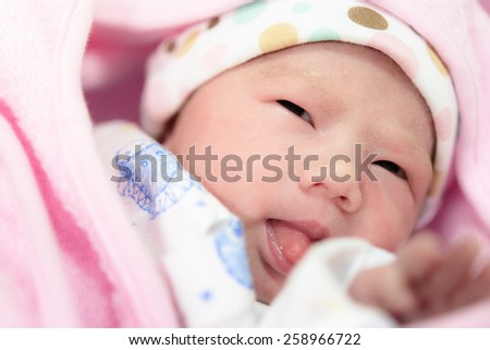 New born baby infant asleep in the blanket