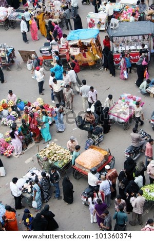 HYDERABAD,AP,INDIA-AUGUST 29:People shopping in the street market near charminar during Ramzan festival August 29 2011 in Hyderabad,Ap,India.About 25 lakh people visit area every Ramzan season.